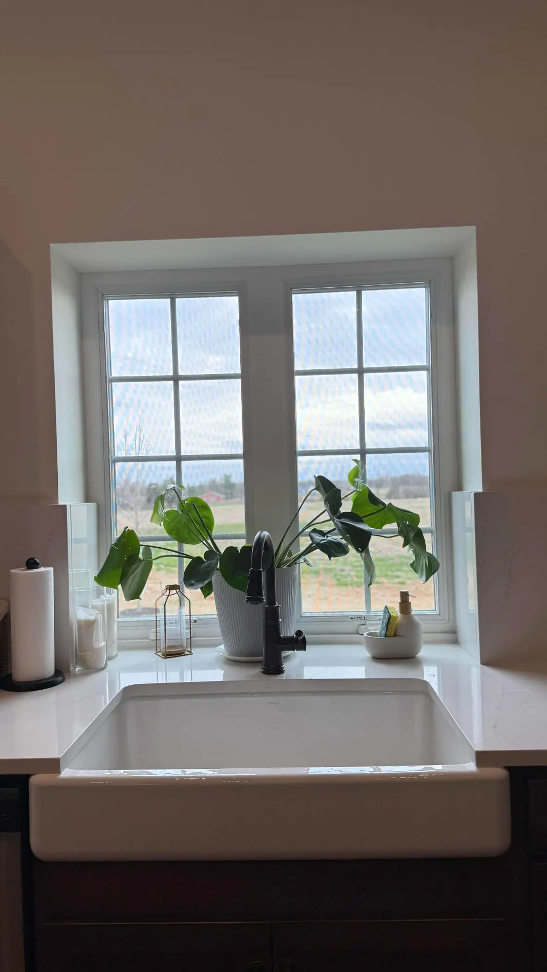 Farmhouse sink and styled window ledge overlooking the Nokesville property