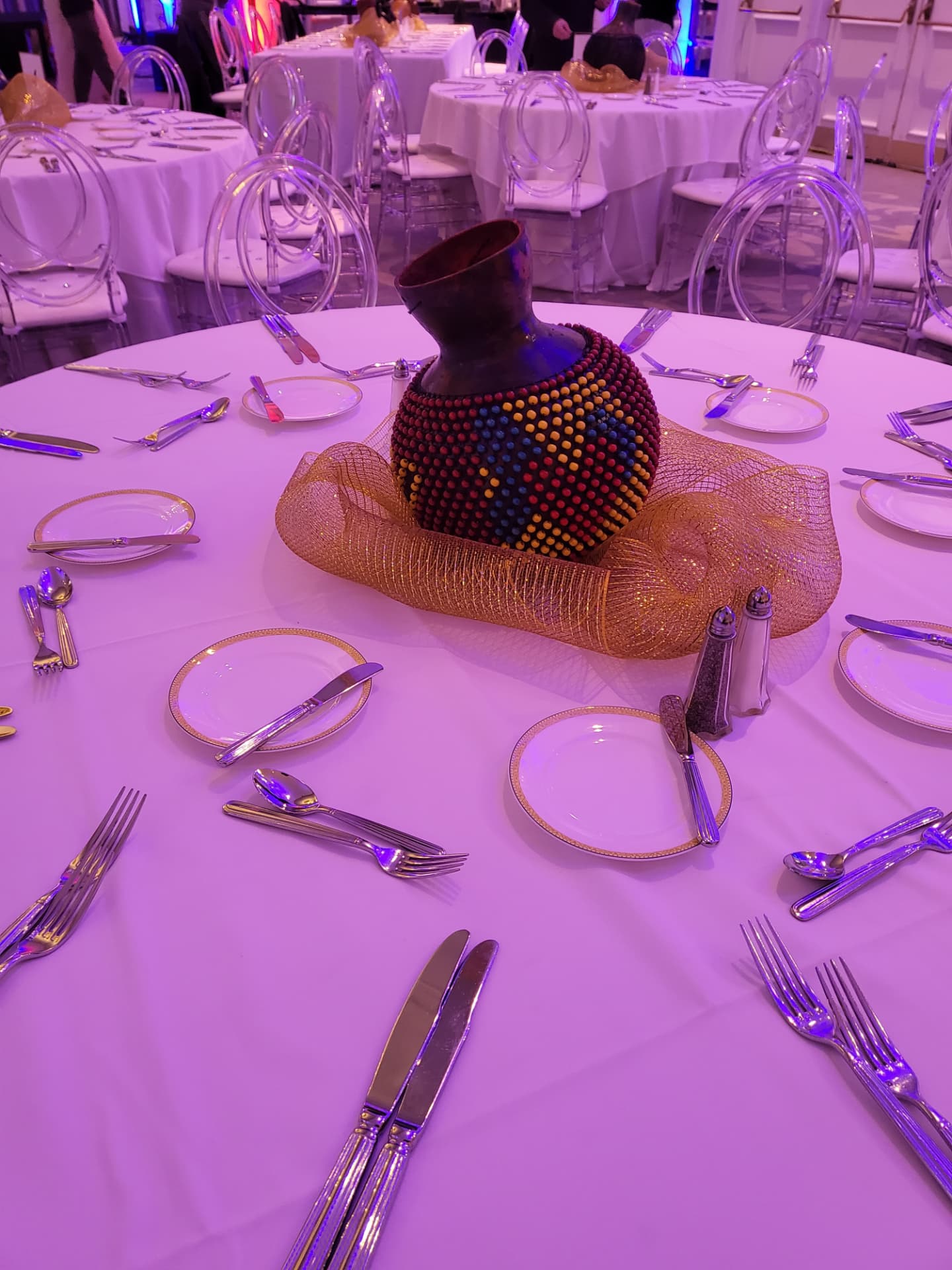 Colorful beaded vessel used as a culturally inspired centerpiece at the International VIP Gala.