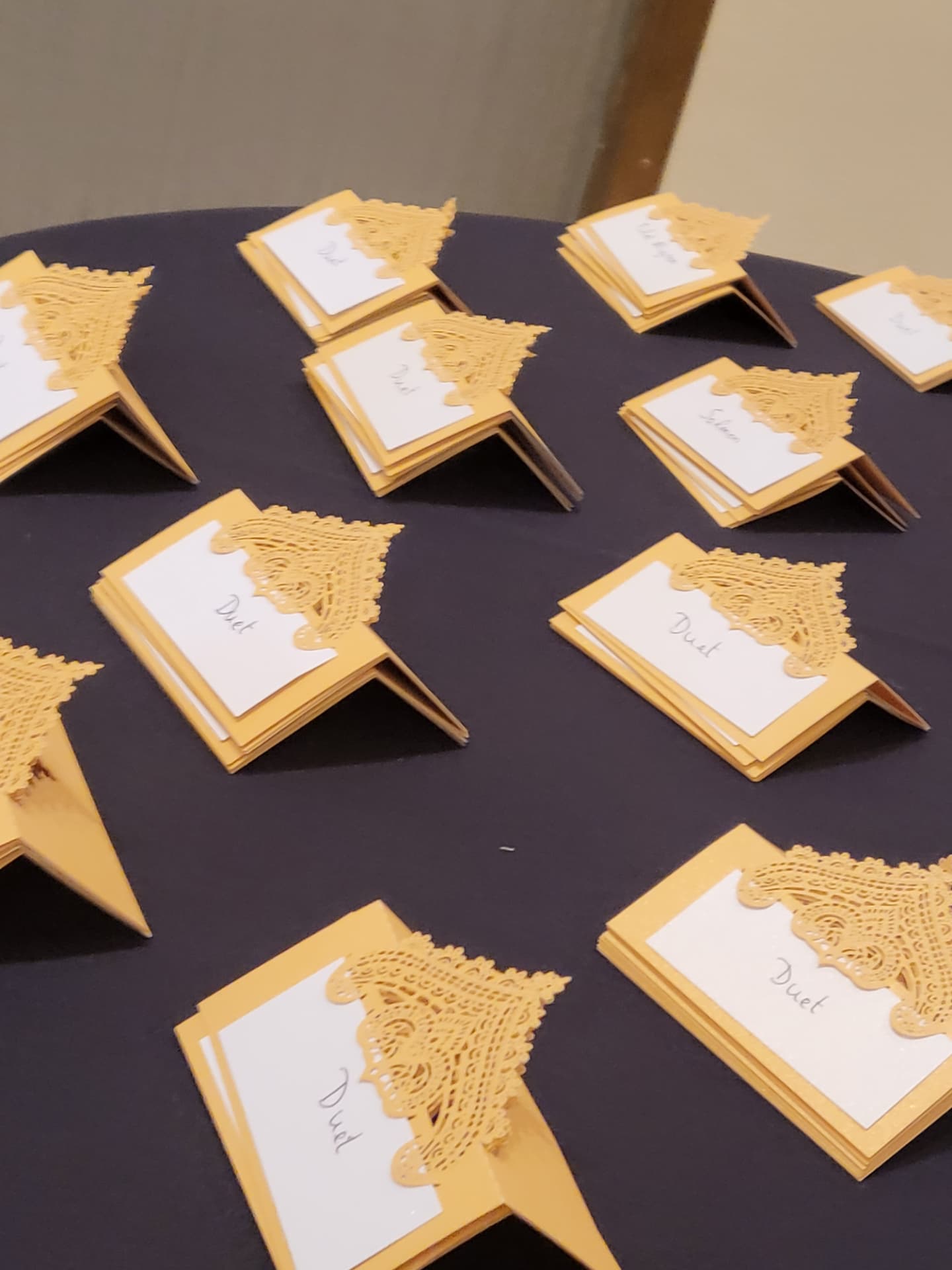 Handmade gold place cards prepared before guests arrived at the International VIP Gala.