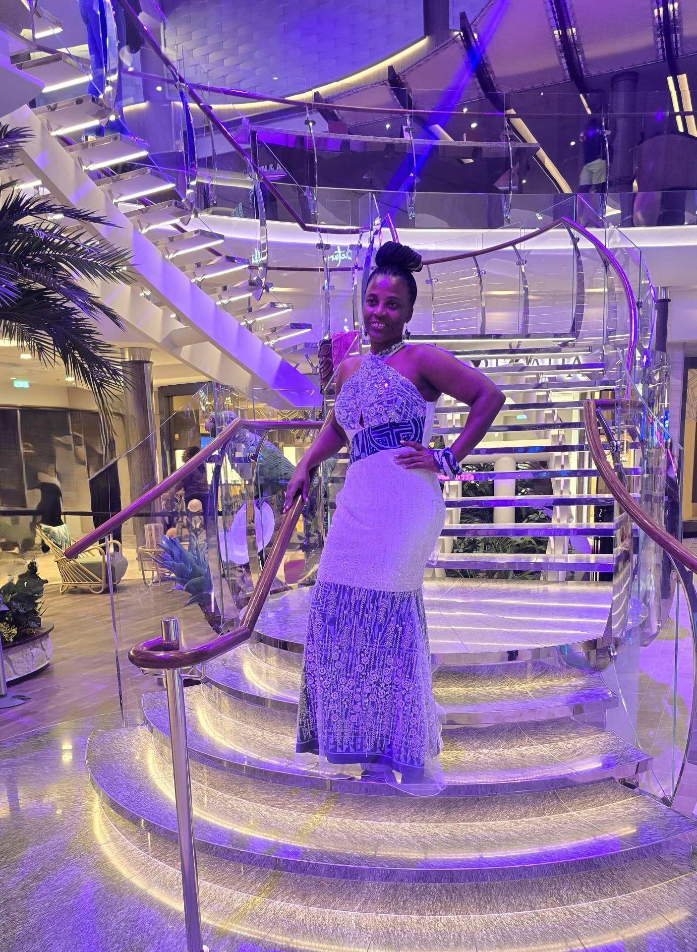 Kemayou Events founder Josiane Djachechi wearing a contemporary outfit featuring traditional Ndop fabric representing her Bamileke heritage aboard Utopia of the Seas.